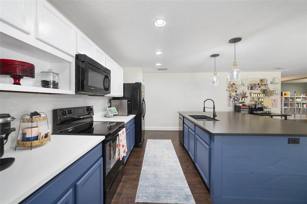 The home chef will also enjoy the recessed lighting, modern two-tone cabinetry and a closet pantry for ample storage.