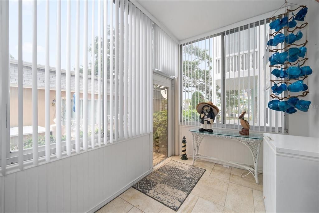 Florida Room leading to courtyard and pool