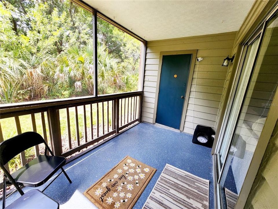 Screened balcony with Sliding Door enters to the living room and the access door from the second bedroom.