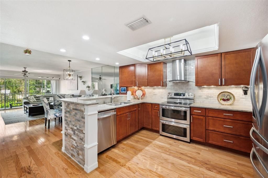Beautifully updated Kitchen with Stainless Appliances, Double Oven Range & Hood.