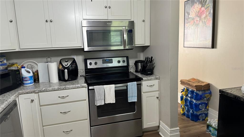 Kitchen with range and microwave