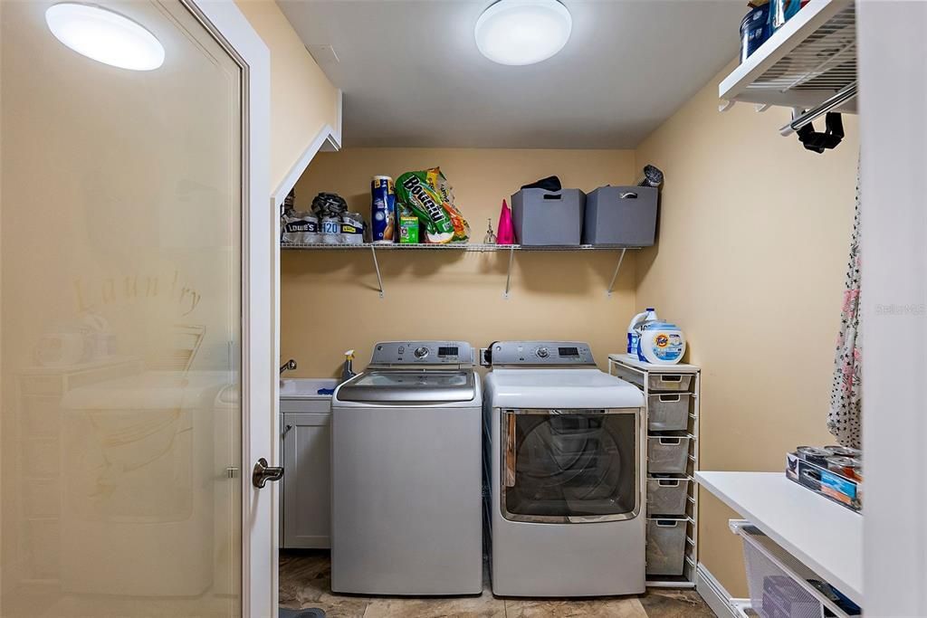 Separate laundry and storage is adjacent to kitchen.