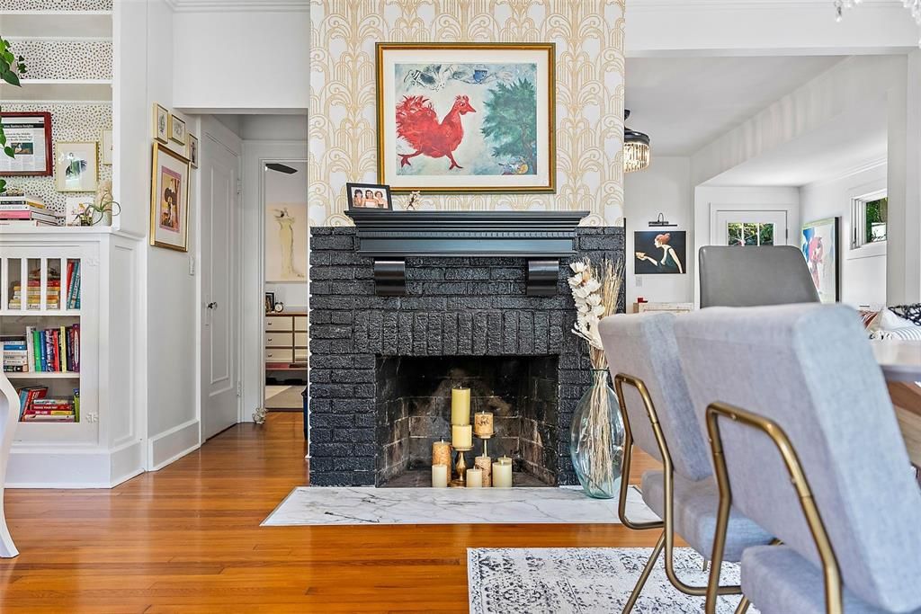 The warmth of the original heart of pine wood flooring and charming fireplace give a delightful nod to yesteryear.