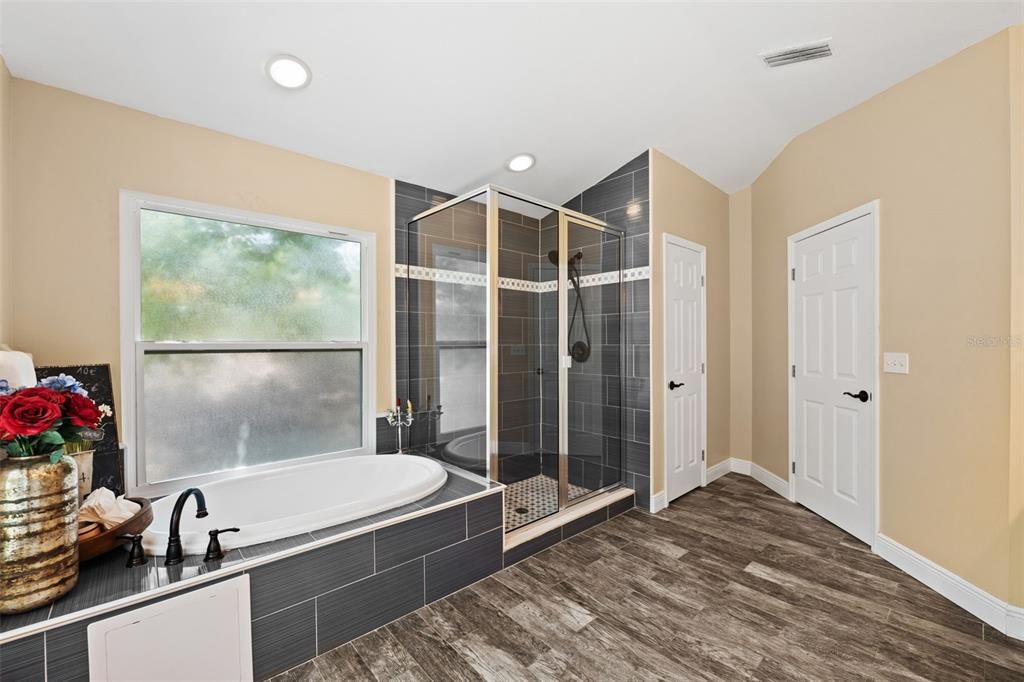 Primary Bathroom w/ tub and shower