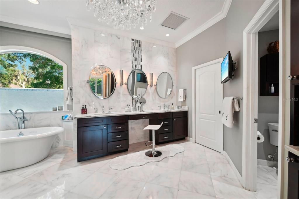 Step into Luxury in the master bathroom which includes, tv, coffee bar, water closet and separate on demand electric water heater