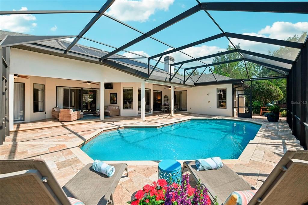 Florida lifestyle is ready and waiting with Solar Heated pool and  900 sq foot lanai with  tongue  and groove ceiling