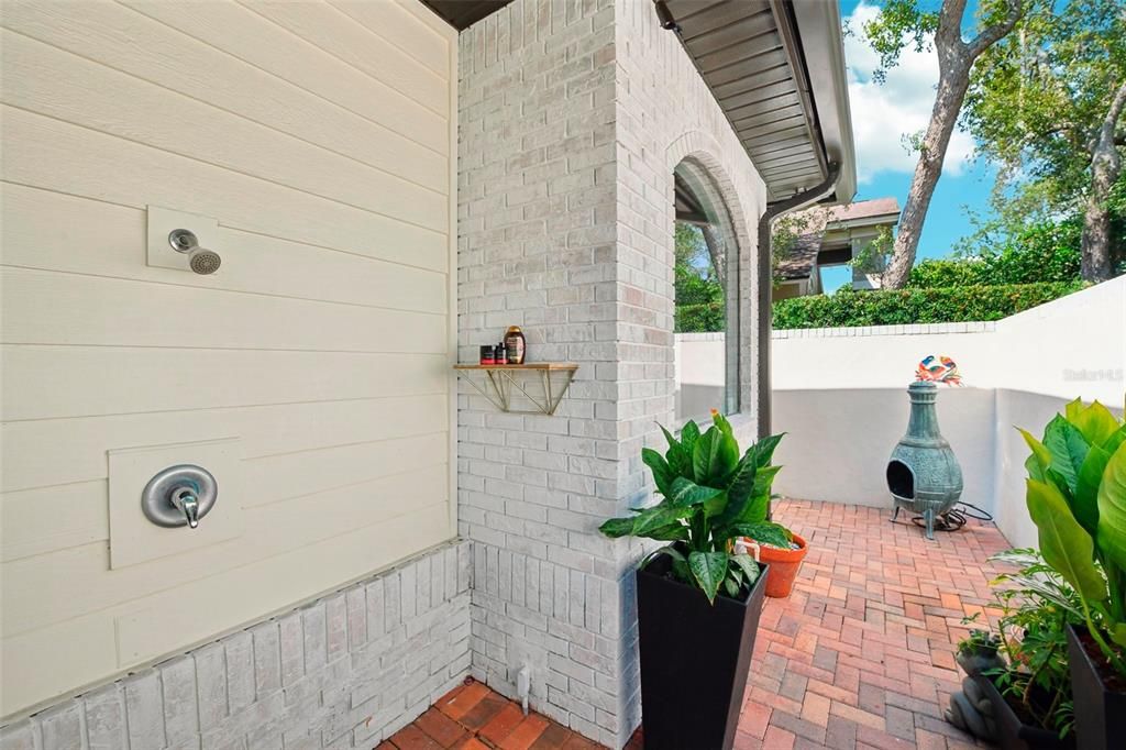 Private courtyard off of master bedroom complete with outdoor shower