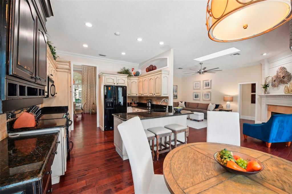 Open concept kitchen, dining and family room at the  heart of the  home