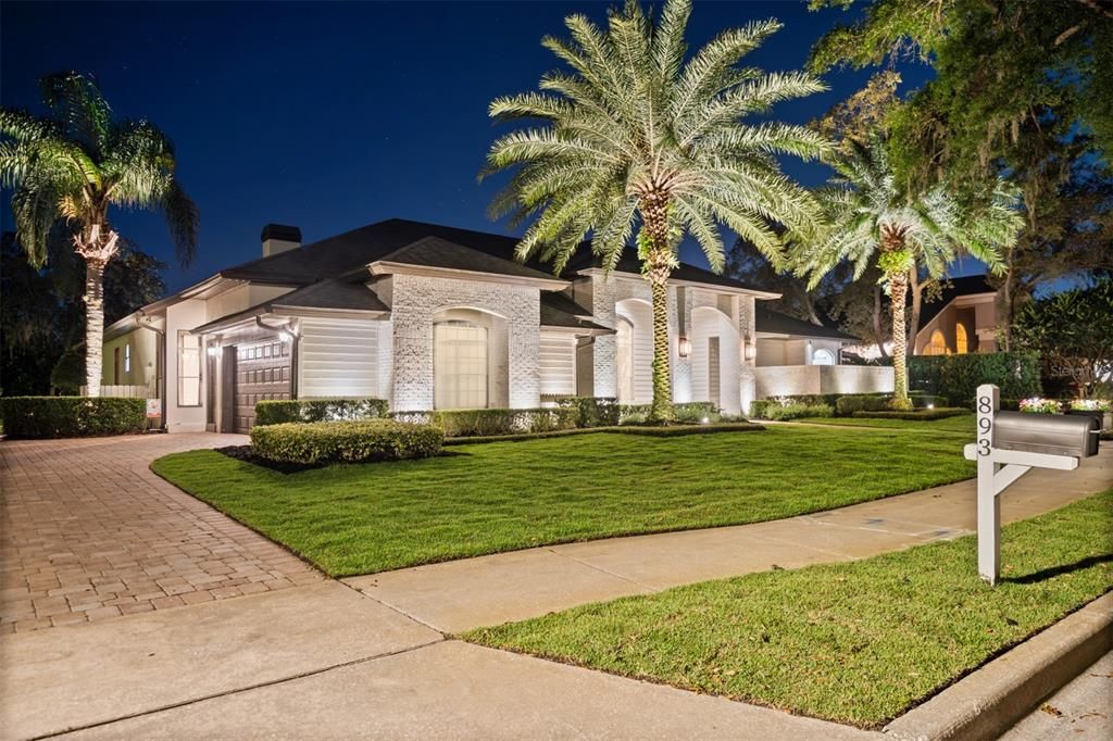 Expansive landscape lighting make this home a must see