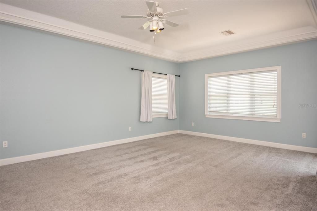 Spacious Owner's Suite Bedroom With Trim Accent Around Tray Ceiling!