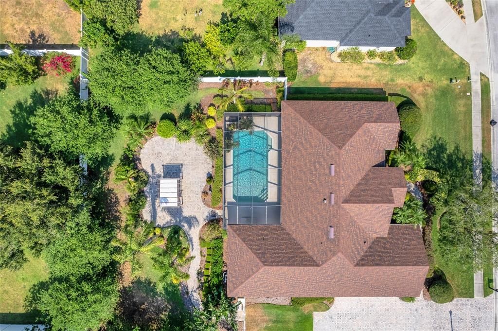 The entire backyard is surrounded by a white PVC privacy fence.