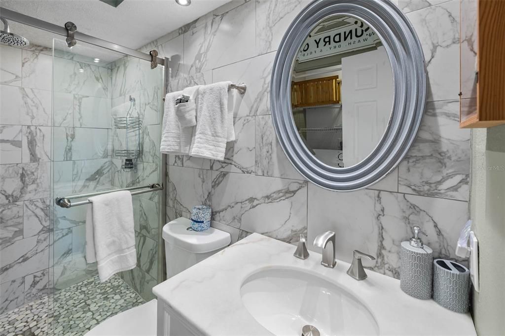 Guest bathroom with marble top vanity.