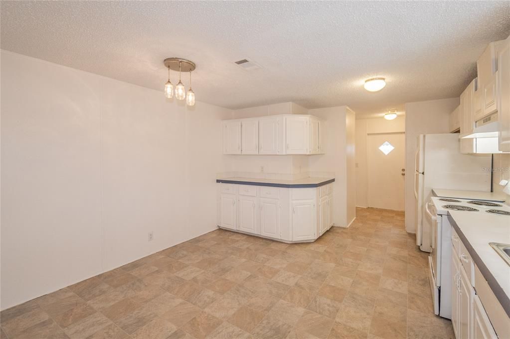 Eating Space in Kitchen is to the Left Under the Light Fixture