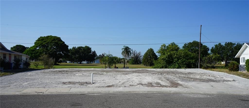 view from street, open space behind the lot to watch wildlife