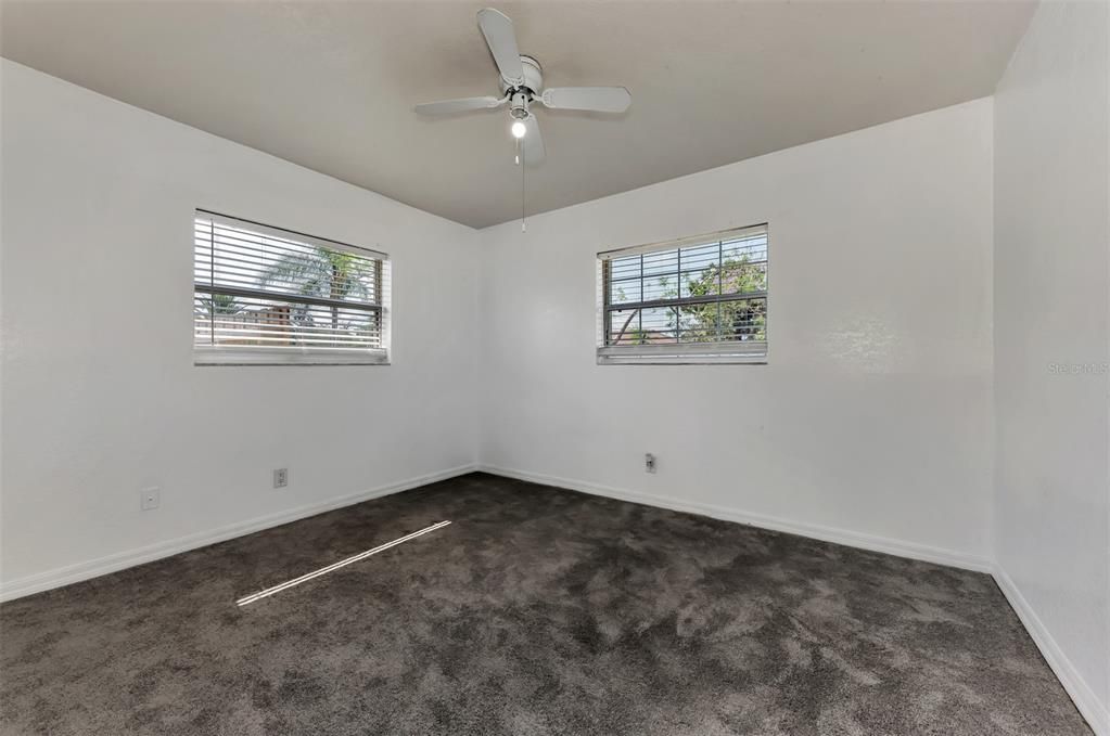 Primary Bedroom with new carpeting & blinds