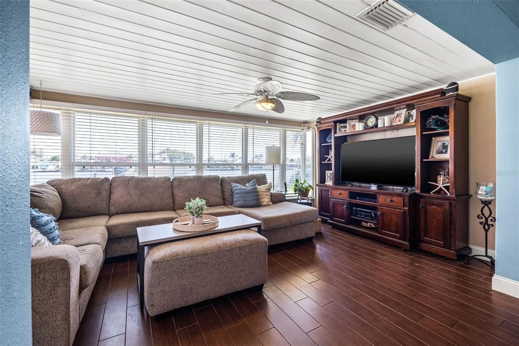 Family room with windows on the entire back wall