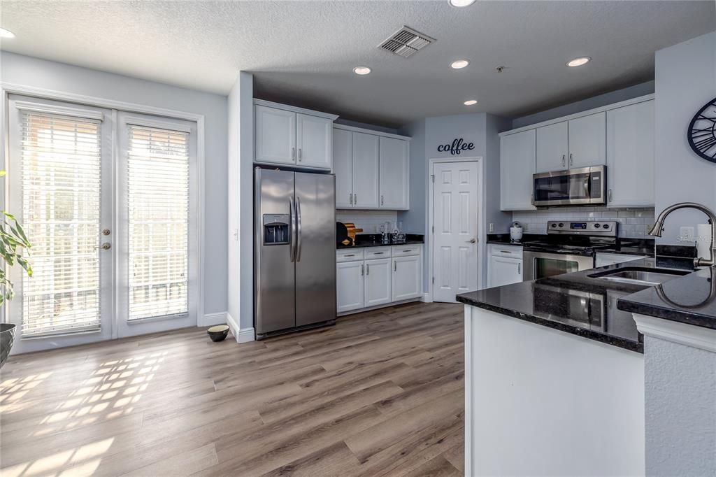 Kitchen, View of Balcony via French Doors