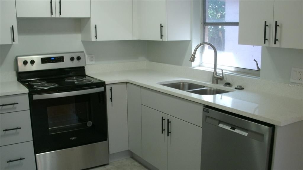 ALL NEW KITCHEN CABINETS AND QUARTZ COUNTERTOPS NEW SINK NEW APPLIANCES