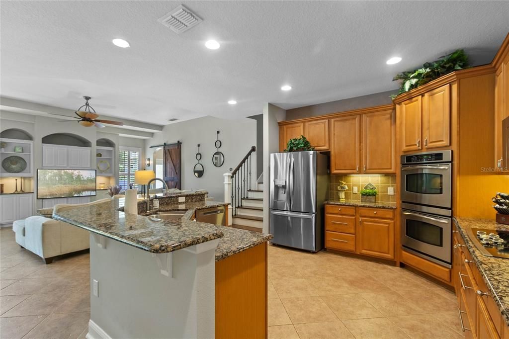 The kitchen is open concept, overlooking the family room and break fast nook.