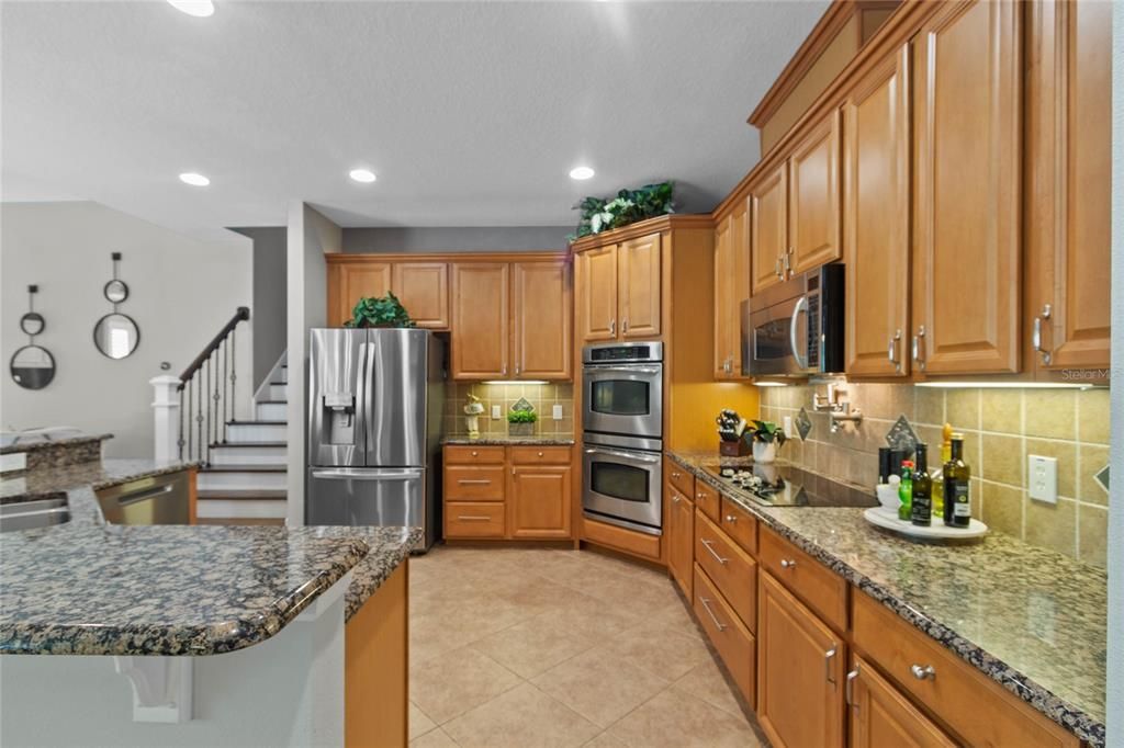 The cabinets are 42" solid wood, the counters are granite, appliances recently updated.