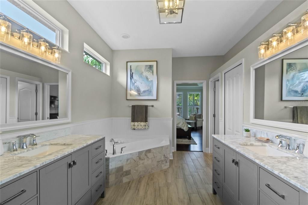The master bath was recently updated to include garden bath, walk in shower with double rain heads, double vanities and updated California closet.