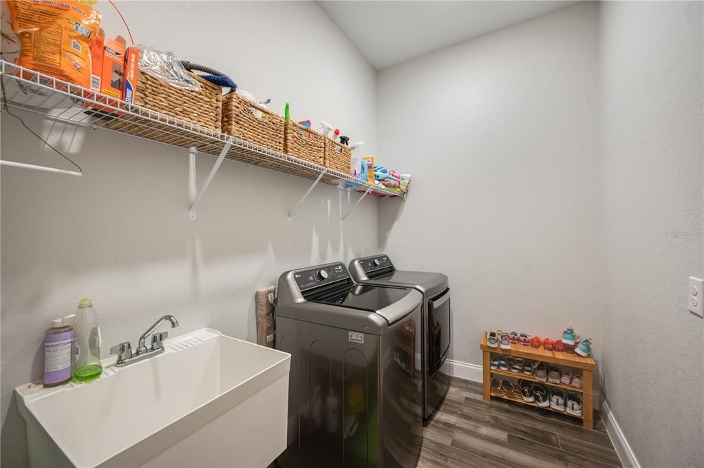 Laundry room with sink (washer and dryer stay with the home)