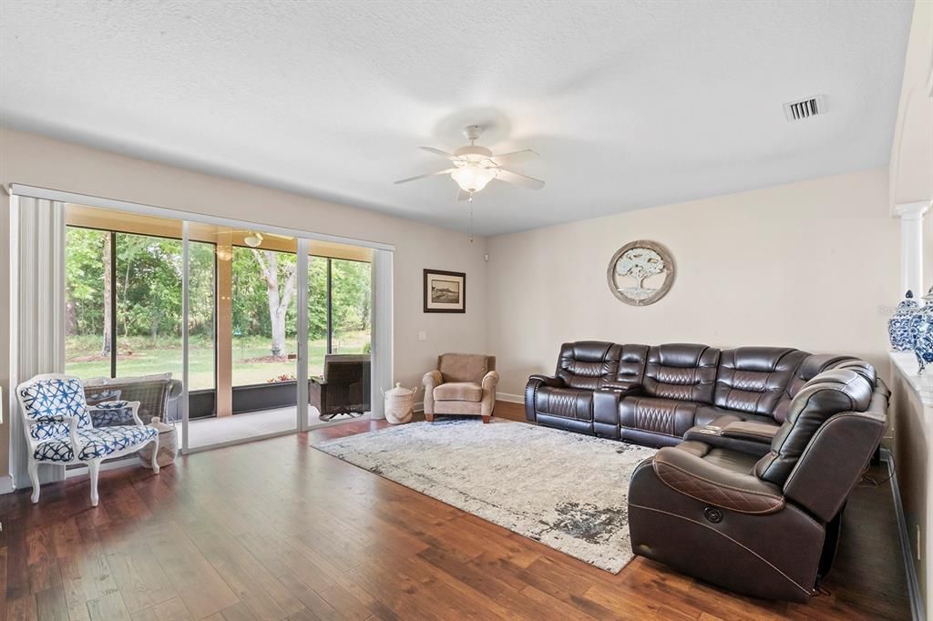 Living Room: Engineered Hardwood Flooring, Large Slider to Extended Lanai