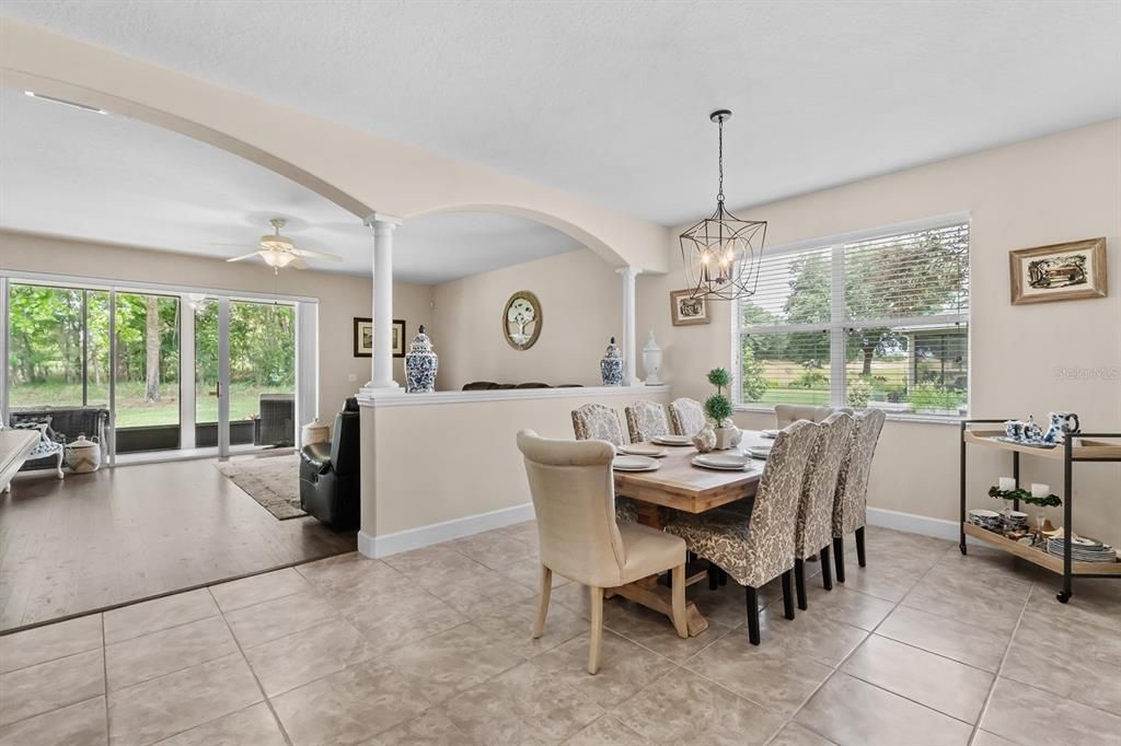 Dining Room & Family Room with View to Screened In/Covered Lanai