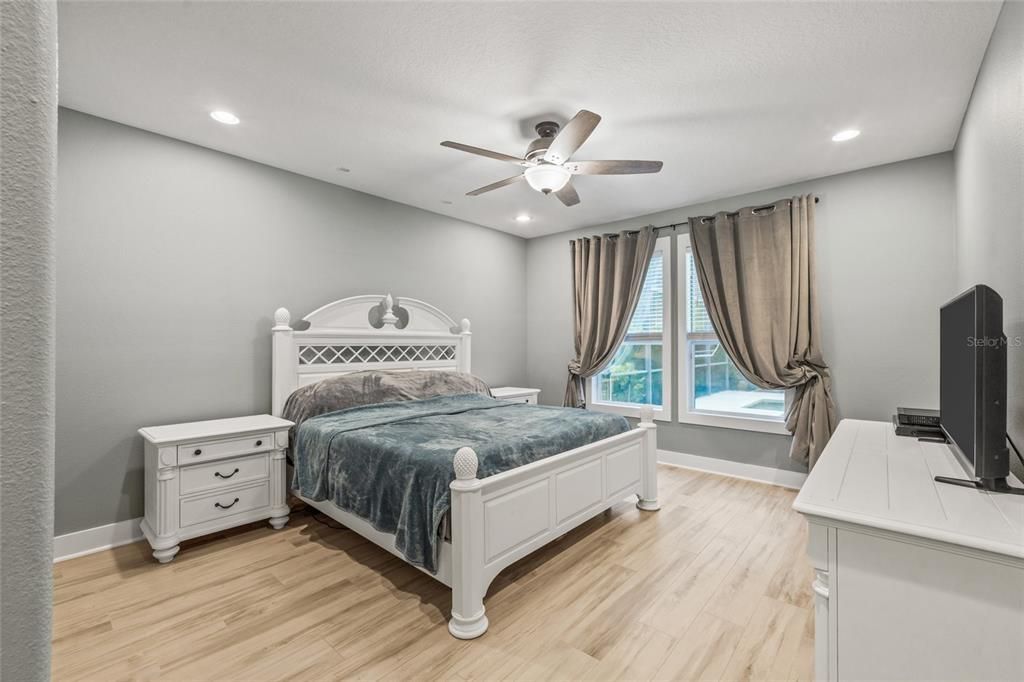 Master bedroom with recessed lighting, all overlooks the pool area!