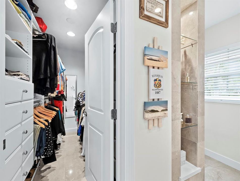 The well appointed walk-in closet of the primary bedroom is just inside the ensuite bath