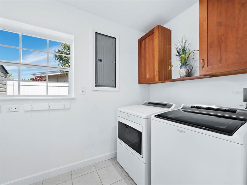 The laundry room is just off the 3rd bedroom