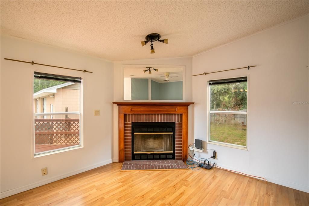The Family Room features large windows and a wood-burning fireplace.