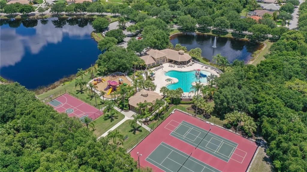 Community East, fitness facility, heated resort-style heated year round pool, spa, waterslide, lighted pickleball, tennis and basketball courts, outdoor area to rent to enjoy birthday parties with the kids, family and guests.
