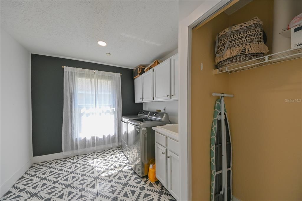 Laundry Room, New Flooring, Cabinets and sink