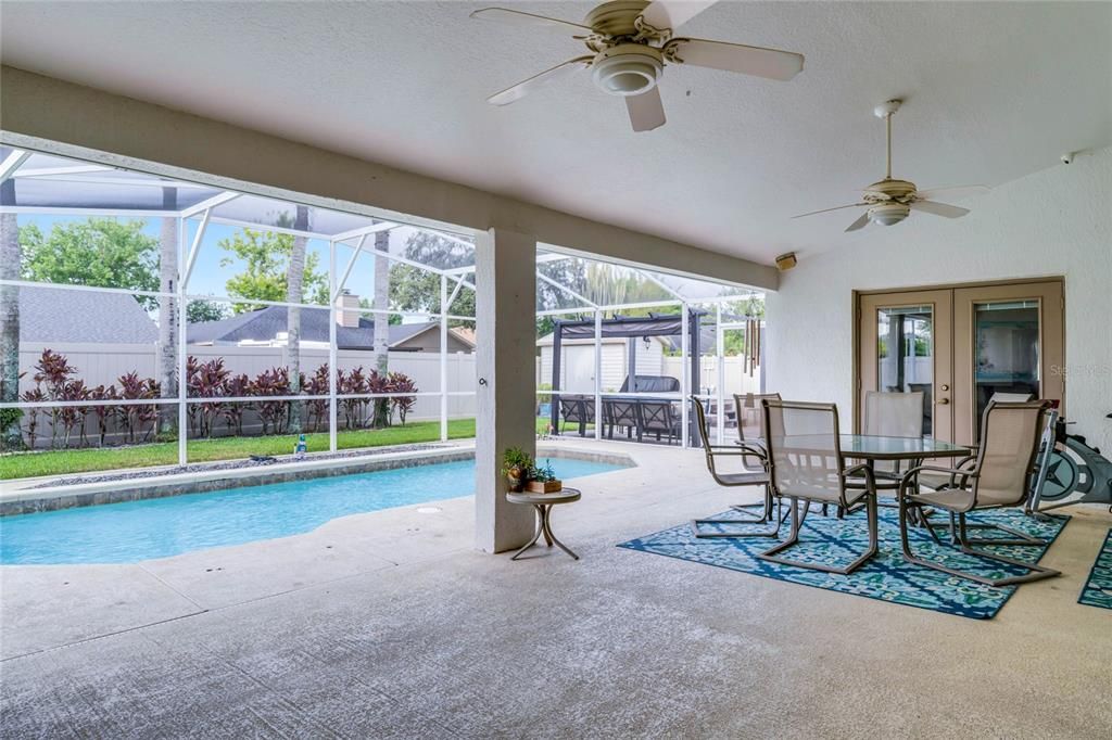 Large covered lanai and screened in salt water pool