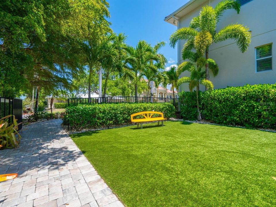 Astro turf area for relaxing - located to north of summer kitchen with walkway to front driveway