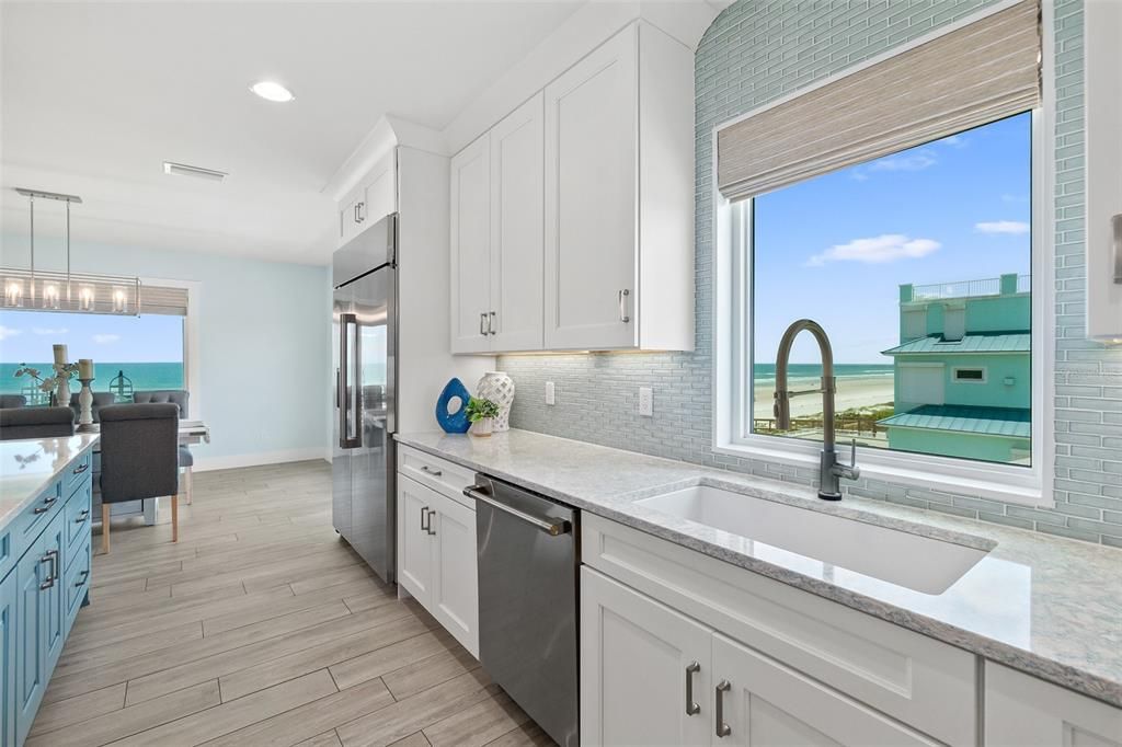 Tile Backsplash to the Ceiling w/Window Over Sink