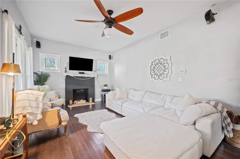 Living room with wood burning fireplace