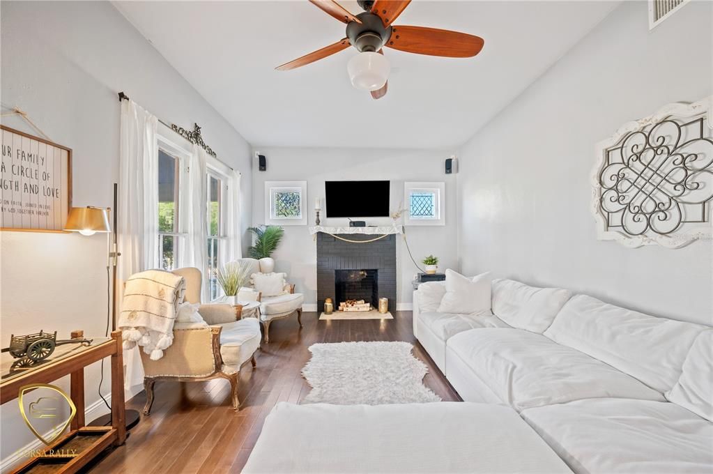 Living room with wood burning fireplace