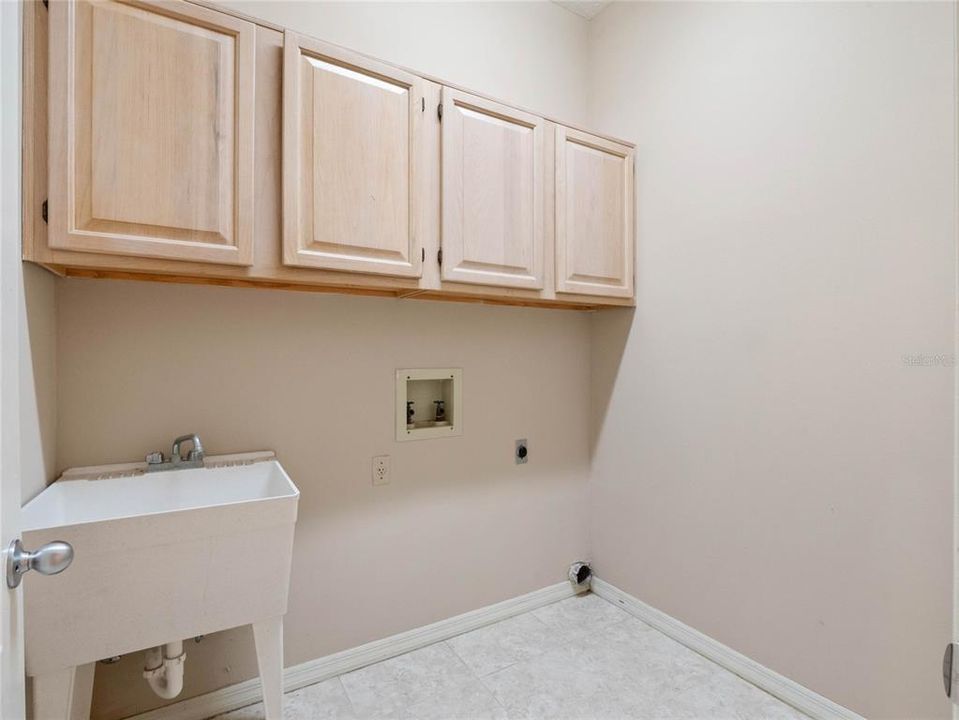 laundry room with storage