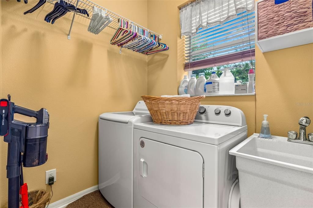 Laundry room with utility sink on first floor