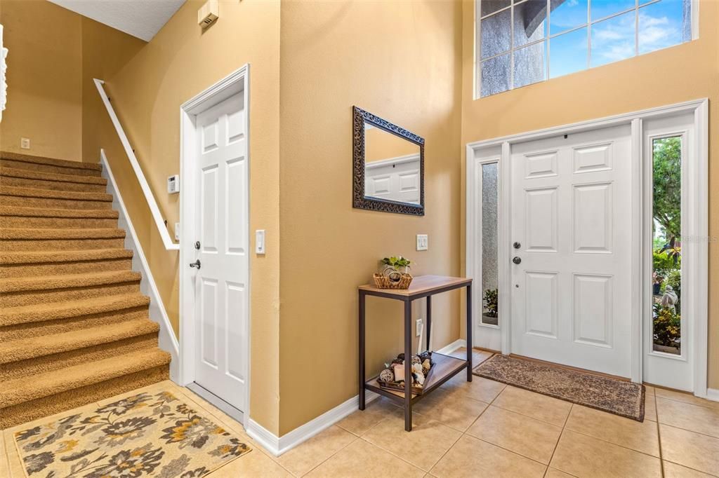 Foyer, door to garage, and stairs to second level