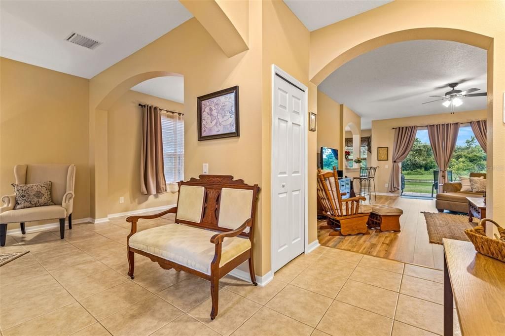 Family Room; to the right of the sliding glass doors is the archway leading to the pool bath, laundry room, and bedroom 2