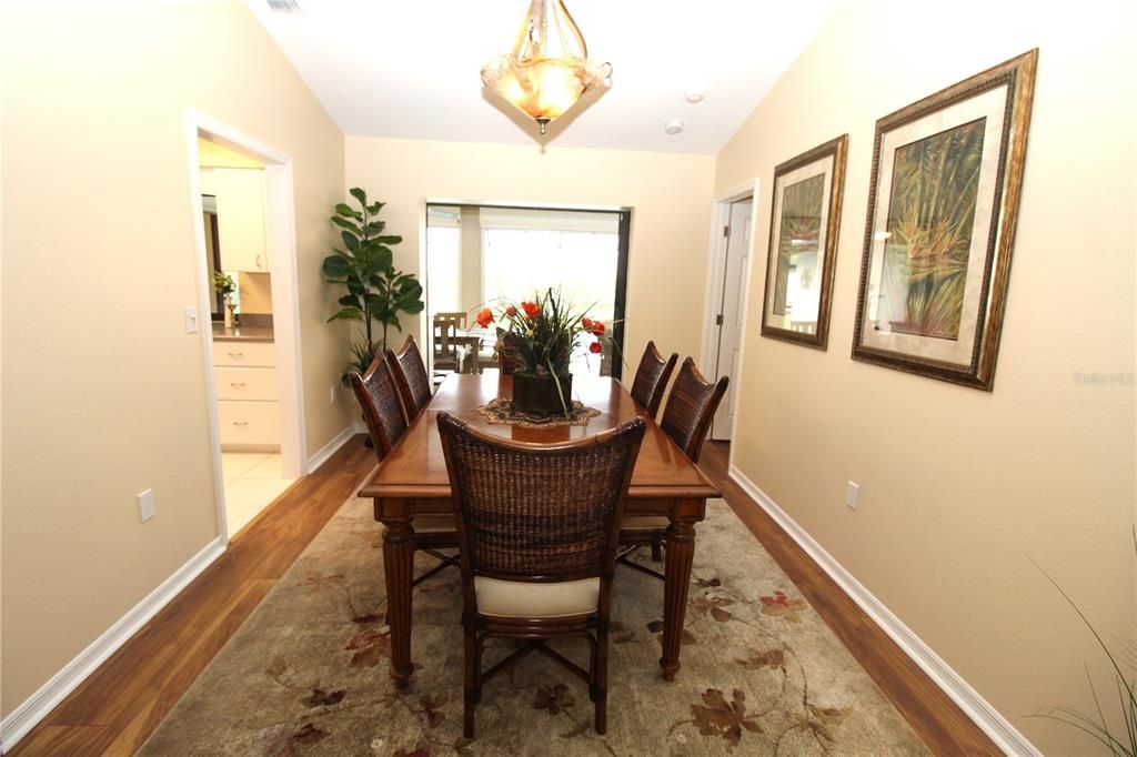 Formal Dining room off Living room....  Pocket sliding glass doors looking out to your private pool....