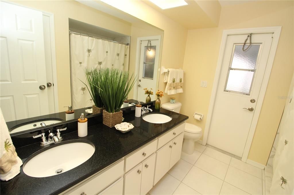 Guest Bathroom has dual sinks and walk-in shower....