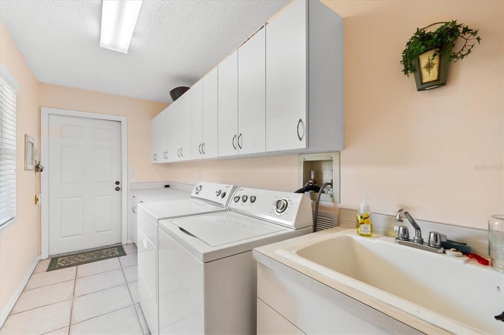 Laundry room with utility sink.