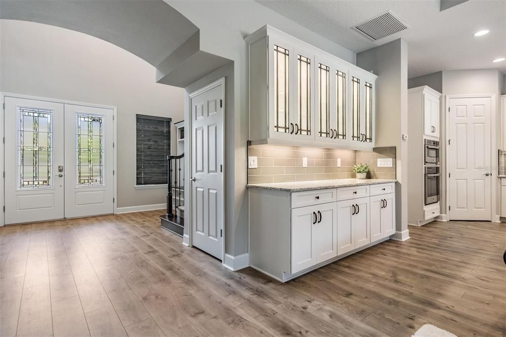 Glass front cabinetry with lighting