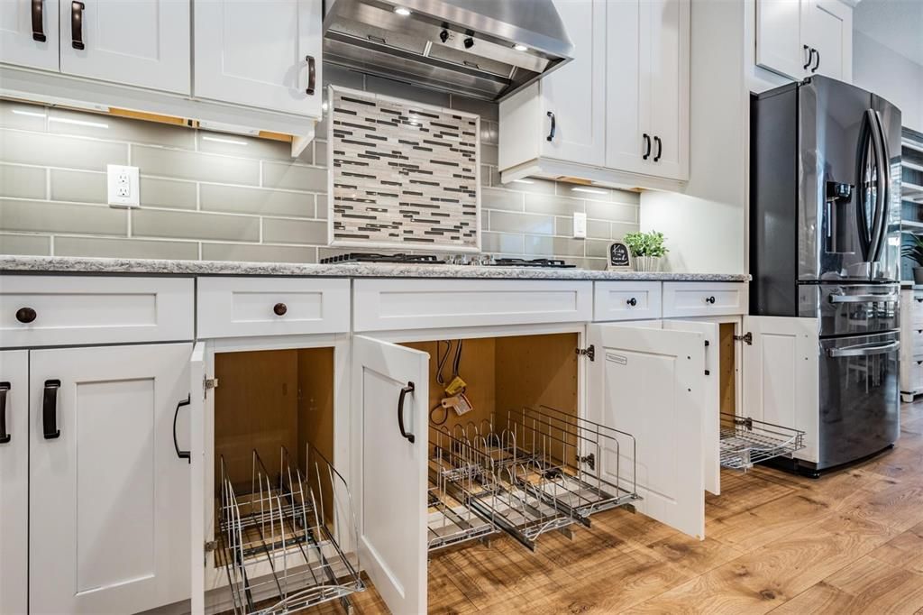 Pull out racks in kitchen cabinetry to make organization a breeze!