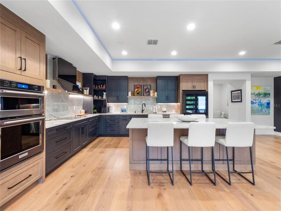 Kitchen features and expansive island with plenty of room for family dining