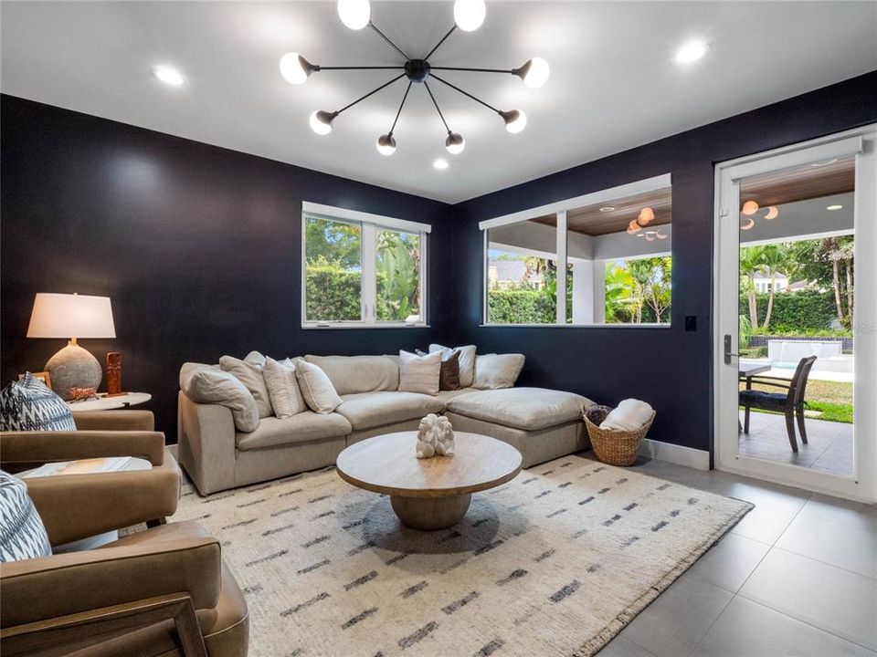 Family room has a door out to the backyard covered patio